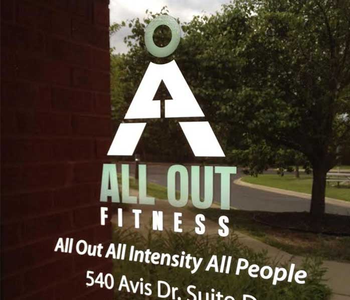 All Out Fitness logo on door sign