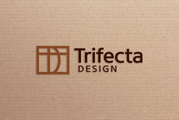 Trifecta Design logo design on cardboard